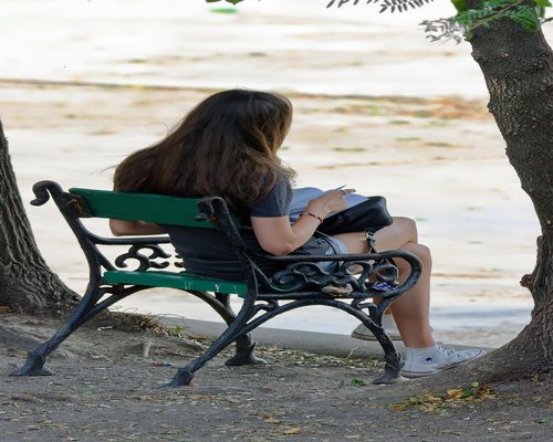 Woman taking a mindful break in her home office reading a magazine